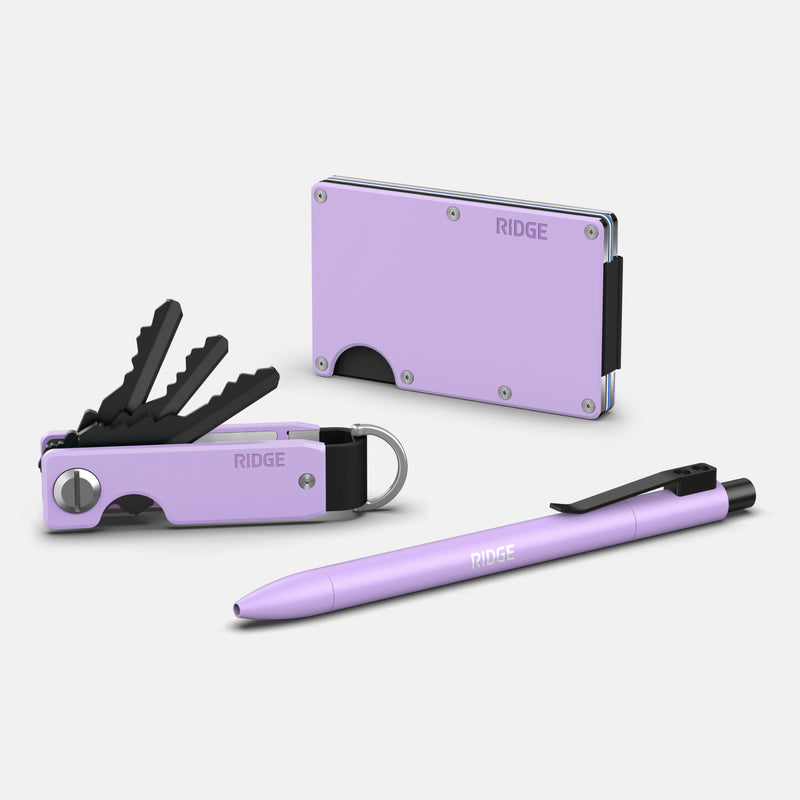 Lavender click pen shown with matching Ridge wallet and key organizer, all in lavender finish.